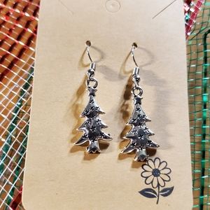 Lovely Silver Christmas Tree with stars engraved within the tree.